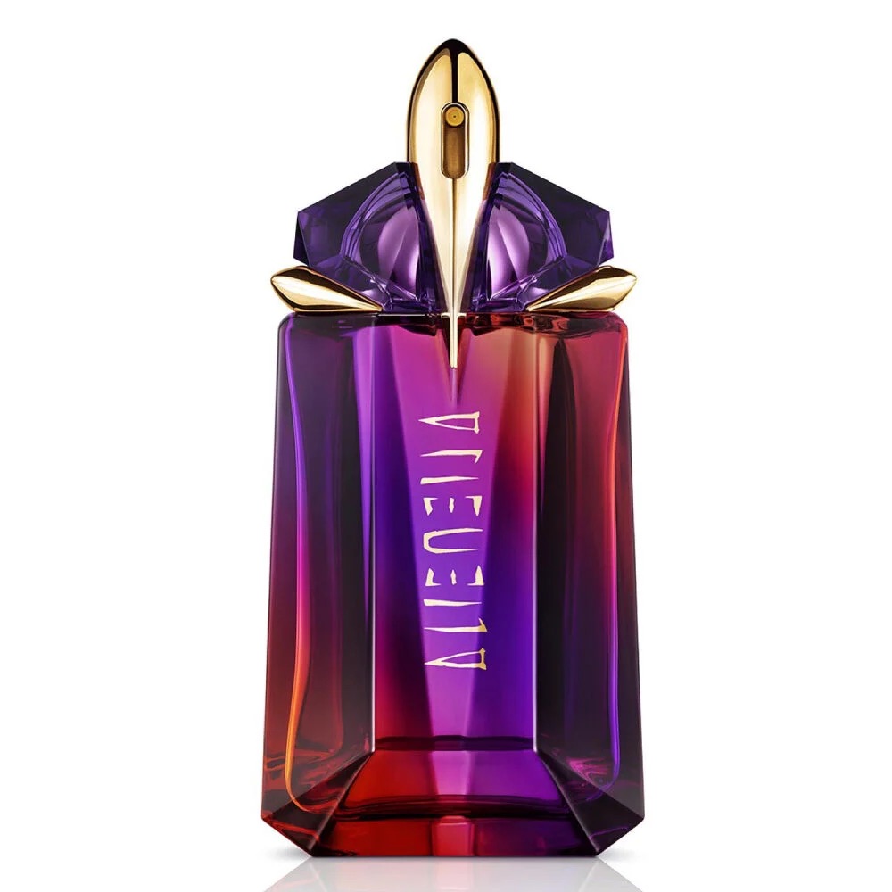 The iconic Alien bottle, a hypnotic prism of design, is reimagined for Alien Hypersense. Lacquered in color-shifting ultra-violet, it radiates a mesmerizing halo of deep red and scarlet-orange, a vivid representation of the fragrance's transforming power. This radiant talisman is not just a container but a symbol of Mugler's unwavering commitment to innovation, beauty, and sustainability, being born refillable to ensure that its magic never ends.